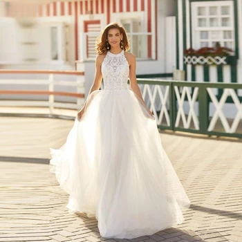 Елегантна линия сватбена рокля за жени 2023 Прост оглавник дантела апликация без гръб без ръкави тюл булчински отглеждани почистване влак