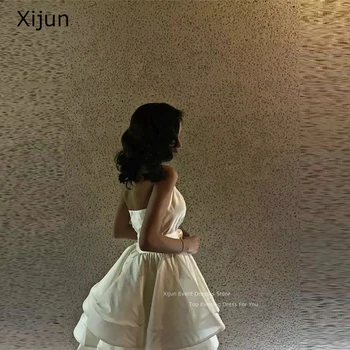 Xijun слонова кост Къси абитуриентски рокли Секси тафта официални вечерни рокли Диференцирани абитуриентски рокли Коляното дължина без ръкави парти рокли Жени